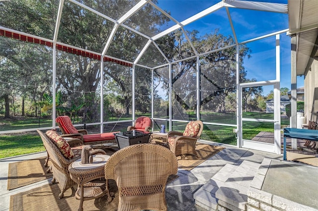 view of patio / terrace featuring a lanai