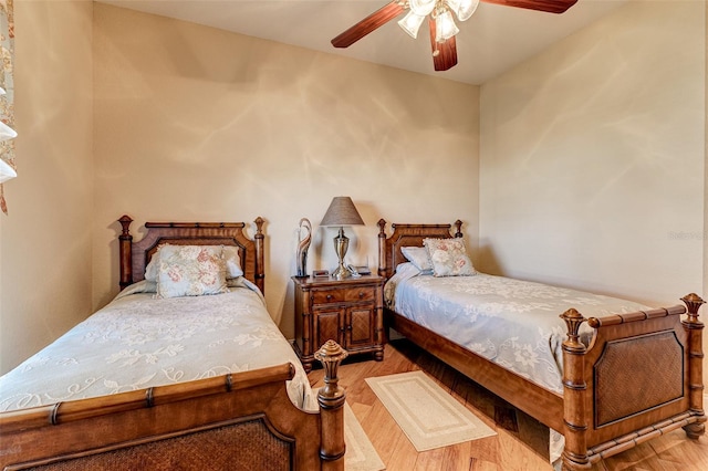 bedroom featuring light hardwood / wood-style floors and ceiling fan