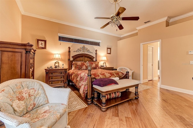 bedroom featuring crown molding, ceiling fan, and light wood-type flooring