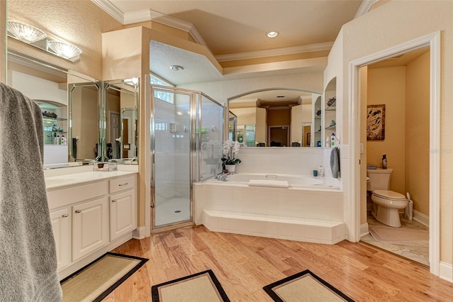 full bathroom with hardwood / wood-style flooring, ornamental molding, separate shower and tub, and vanity