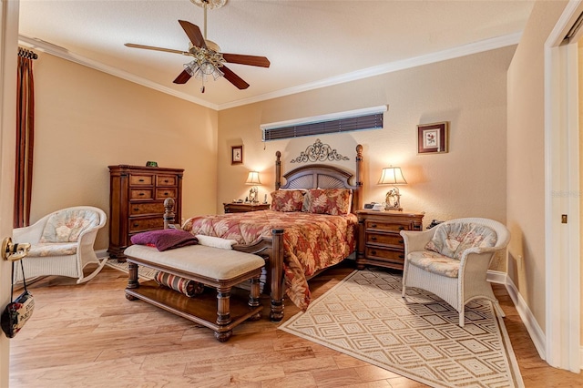 bedroom with crown molding, ceiling fan, and light hardwood / wood-style floors