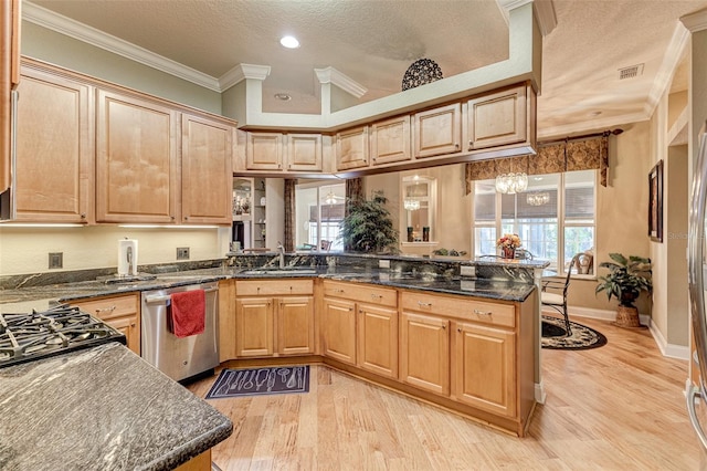 kitchen featuring crown molding, stainless steel dishwasher, kitchen peninsula, and sink