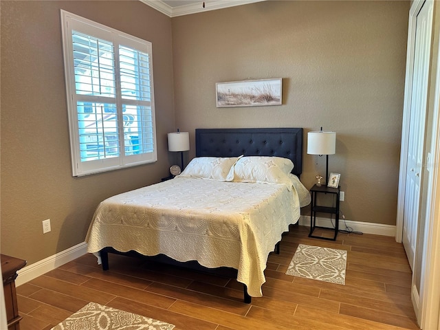 bedroom featuring crown molding