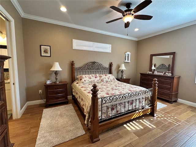 bedroom with ornamental molding, a textured ceiling, ceiling fan, and light hardwood / wood-style flooring