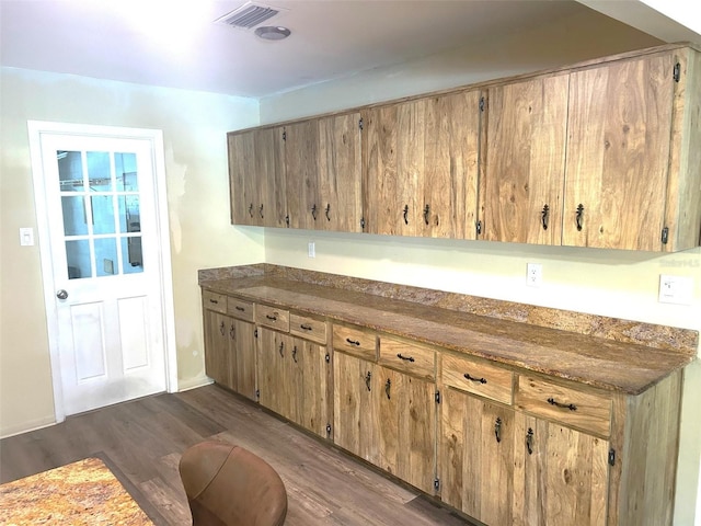 kitchen with dark hardwood / wood-style flooring