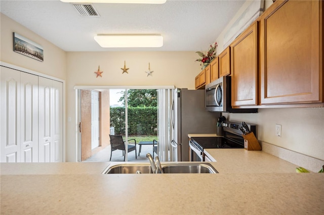 kitchen featuring sink and appliances with stainless steel finishes