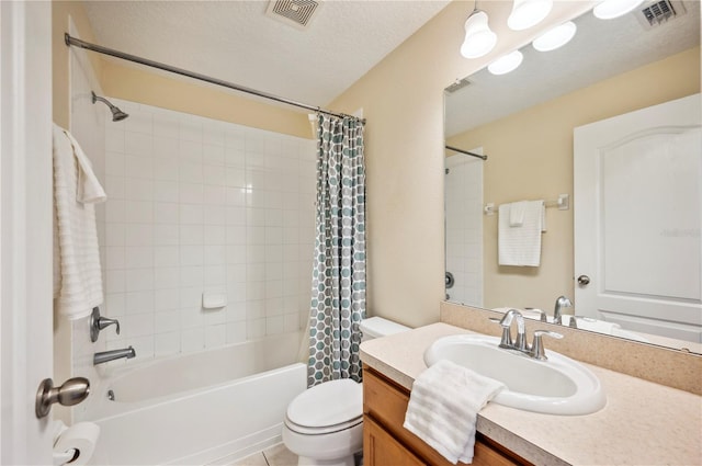 full bathroom with vanity, shower / bath combo with shower curtain, a textured ceiling, and toilet