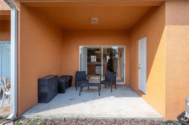 doorway to property with a patio area