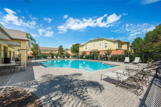 view of swimming pool featuring a patio