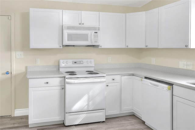 kitchen with white cabinets and white appliances