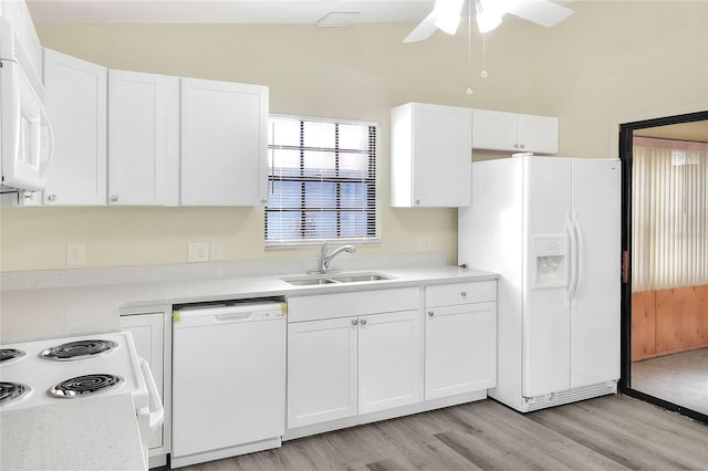 kitchen with sink, white cabinetry, vaulted ceiling, light hardwood / wood-style flooring, and white appliances