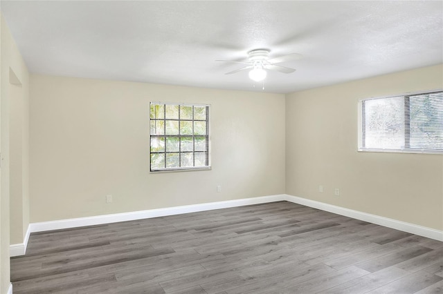 unfurnished room featuring hardwood / wood-style flooring and ceiling fan