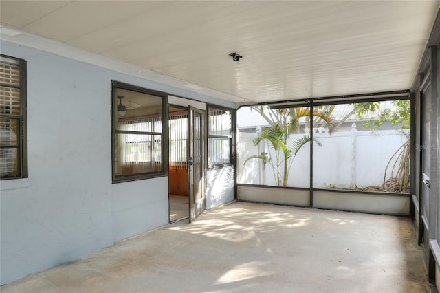 unfurnished sunroom with plenty of natural light