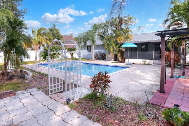 view of pool featuring a patio and a sunroom