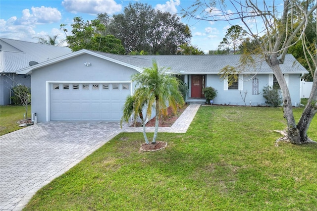 ranch-style house featuring a garage and a front yard