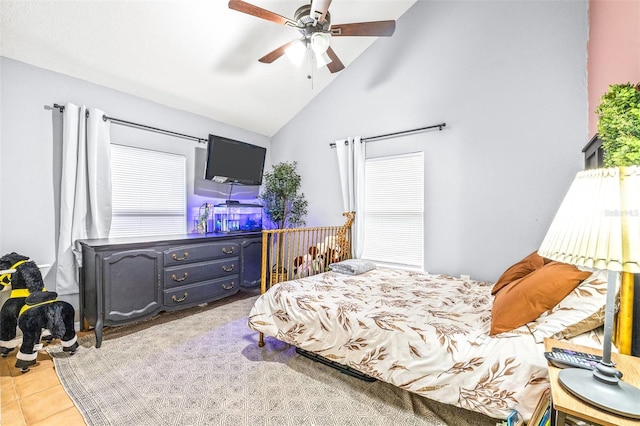 bedroom featuring ceiling fan, high vaulted ceiling, and light tile patterned floors