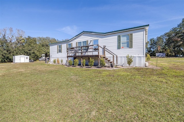 view of front facade featuring a wooden deck, a storage unit, and a front yard