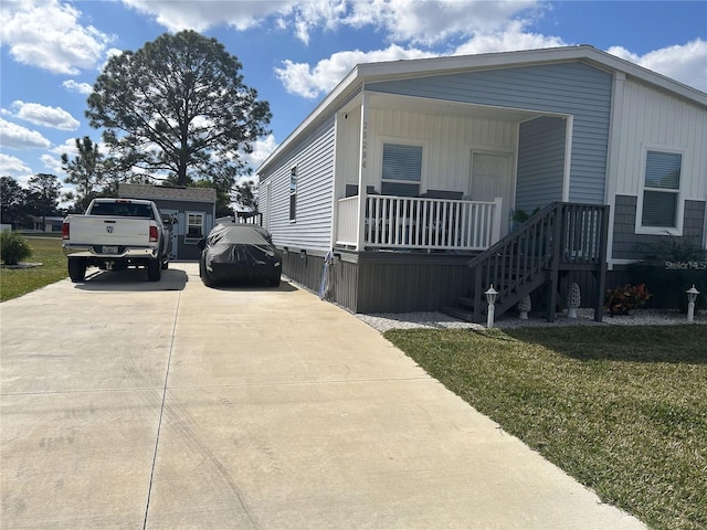 view of front of home featuring covered porch and a front yard