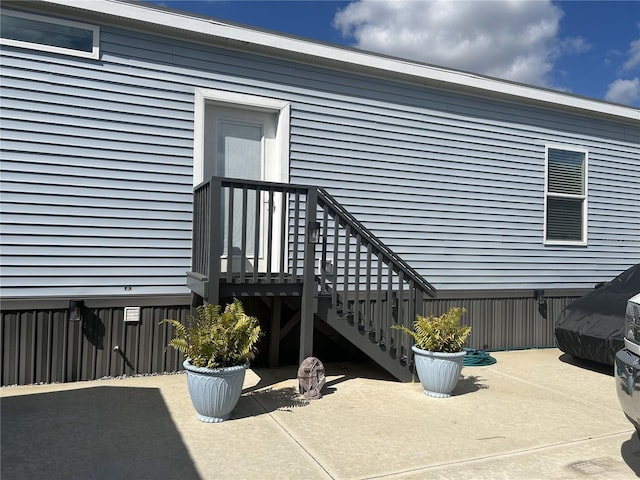 entrance to property with a patio