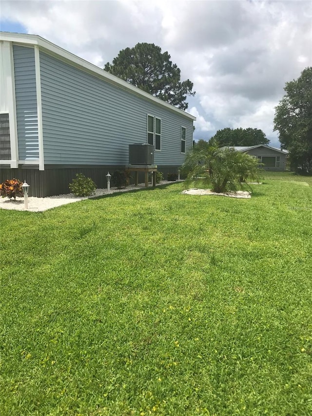 view of property exterior featuring a lawn