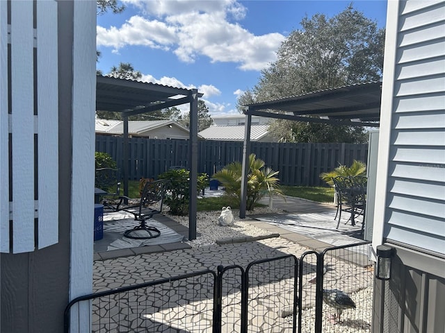 view of patio with a pergola and fence private yard