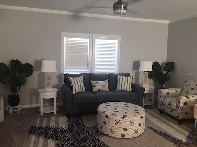 living room with ornamental molding, ceiling fan, and baseboards