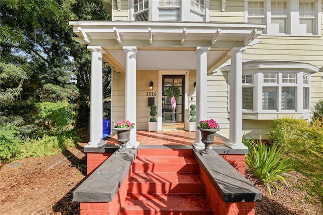 property entrance with covered porch