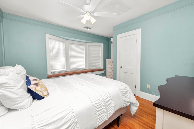 bedroom featuring wood-type flooring and ceiling fan