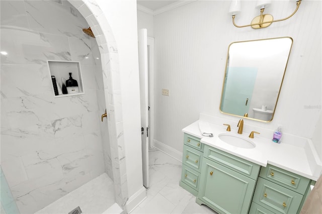 bathroom featuring crown molding, vanity, and a tile shower