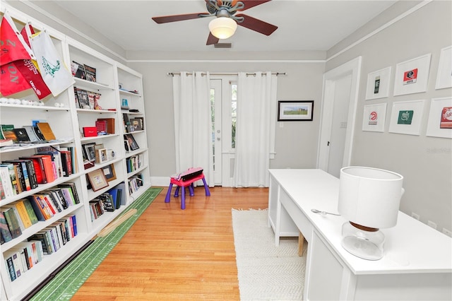 interior space with hardwood / wood-style flooring and ceiling fan