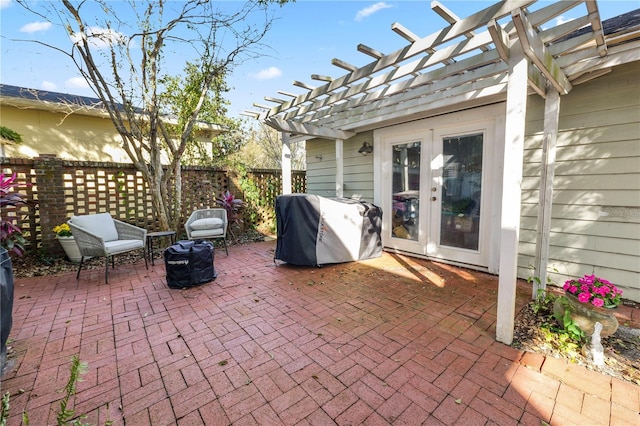 view of patio / terrace with a grill and a pergola