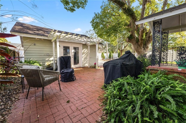 view of patio / terrace featuring french doors and a grill