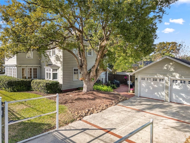 view of front of house featuring a garage and an outdoor structure