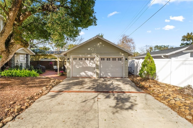 view of front of property featuring an outbuilding and a garage