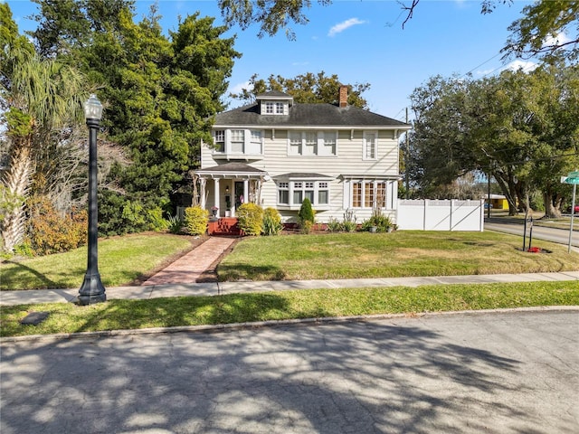 colonial home with a front yard