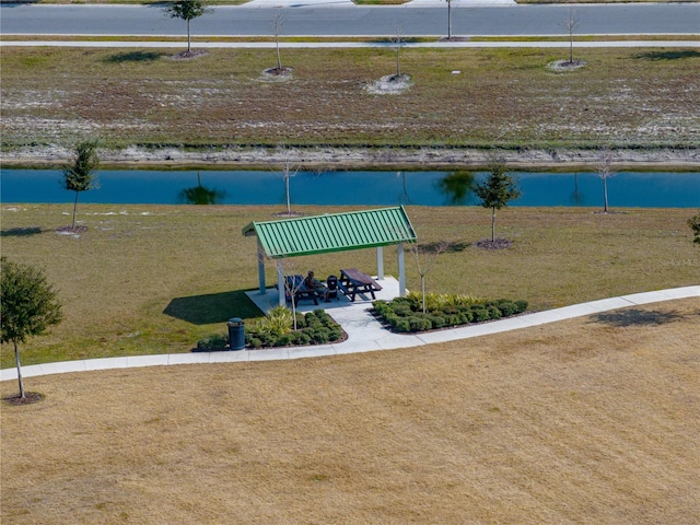 view of property's community with a gazebo and a water view