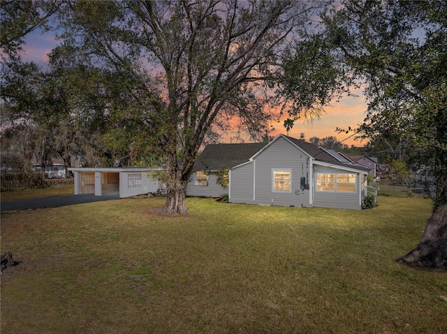 view of yard at dusk