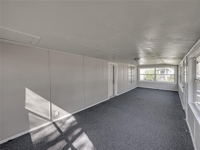 unfurnished sunroom with vaulted ceiling