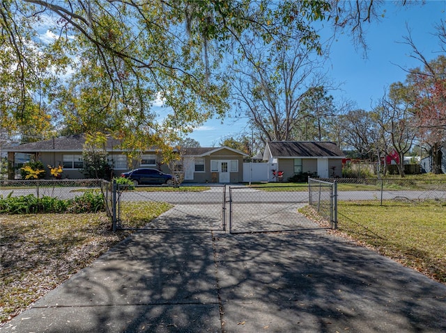 ranch-style house featuring a front lawn