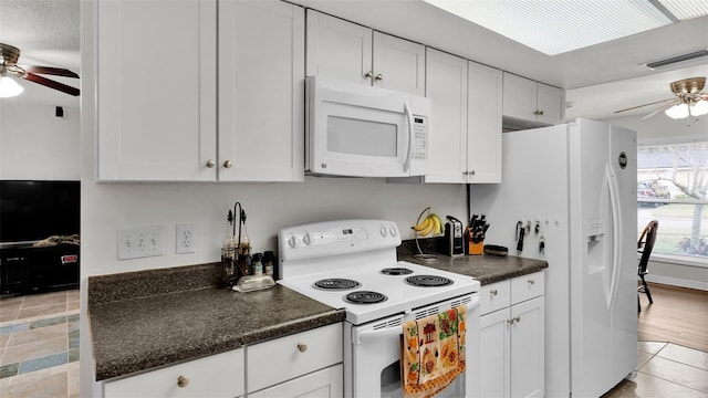 kitchen with ceiling fan, white appliances, and white cabinets