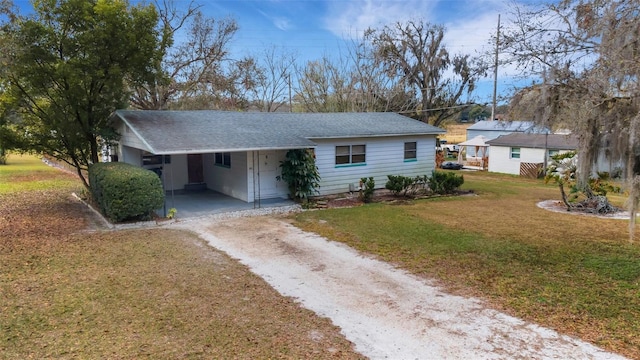 single story home with a carport and a front yard