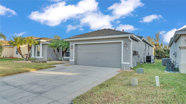 single story home with central AC, a garage, and a front yard