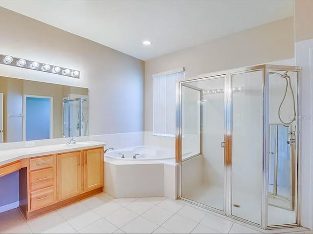 bathroom with vanity, tile patterned floors, and plus walk in shower