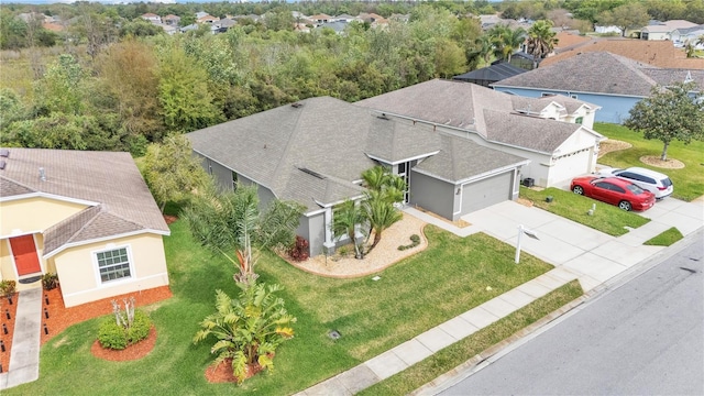 birds eye view of property with a residential view