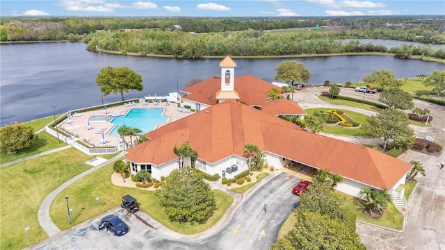 bird's eye view with a forest view and a water view