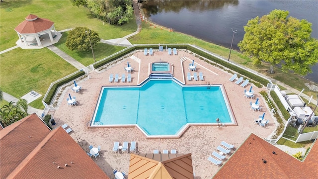 birds eye view of property with a water view