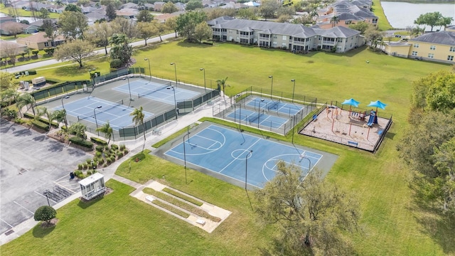 bird's eye view featuring a residential view and a water view