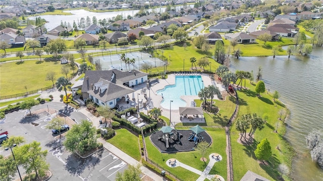 birds eye view of property with a residential view and a water view