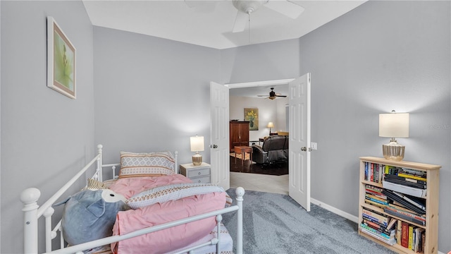 bedroom featuring ceiling fan and baseboards