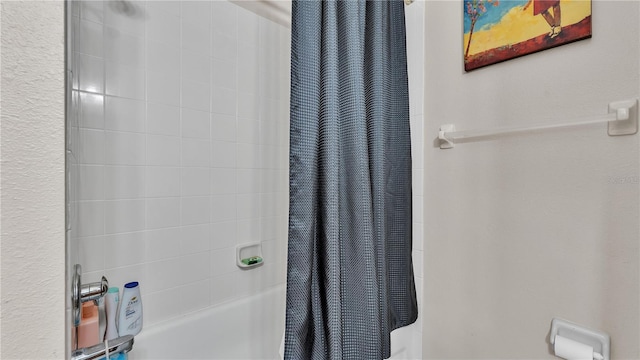 bathroom featuring shower / bath combination with curtain